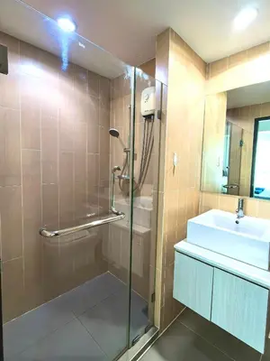 a bathroom with a shower and a sink at centrio Phuket A68 in Ban Rangeng
