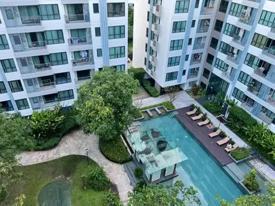 an aerial view of an apartment complex with a swimming pool at centrio Phuket A68 in Ban Rangeng
