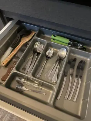 a tray filled with utensils in a drawer at Sunny The Deck Patong Apartment in Patong Beach