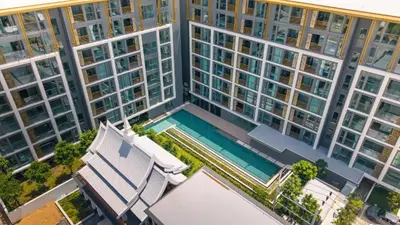 an overhead view of a large building with a swimming pool at Suite Anafi 2BR Pool Gym Access Ozone in Laguna Phuket