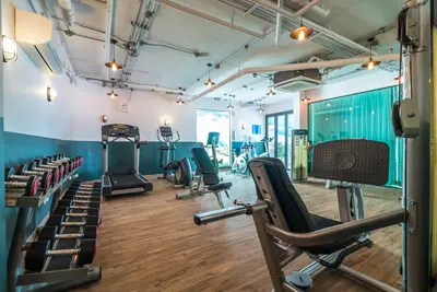 a gym with cardio equipment and treadmills at Sea view studio near Tri Trang & Merlin beach in Patong Beach