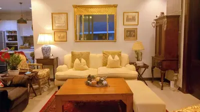 a living room with two couches and a table at 4-Bedroom cozy pool villa in the heart of Bang Tao in Laguna Phuket