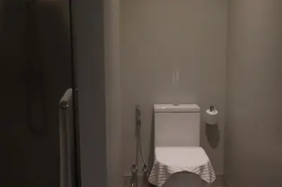 a bathroom with a white toilet in a room at Botanica Four Season Luxury Pool Villa in Phuket