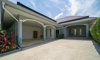 an image of a house with a driveway at Greenleaf Estate - 3bedroom Villa with large shared pool, Nai harn beach in Rawai Beach