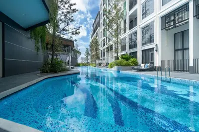 a swimming pool in the middle of a building at Apartment in Laguna perfect location in Laguna Phuket