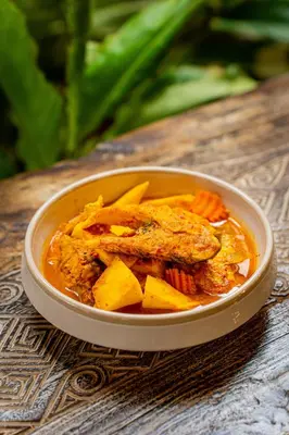 a bowl of food with meat and vegetables on a table at Chaykha Retreat