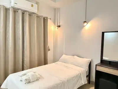 a small room with two beds and a mirror at Home in Chalong 3 Bedrooms Fully Furnished in Ban Suan
