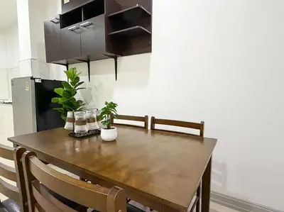 a wooden table in a kitchen with some plants on it at Home in Chalong 3 Bedrooms Fully Furnished in Ban Suan