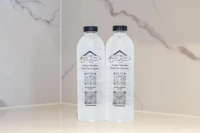 two bottles of water sitting next to each other at KORA 243 One-Bedroom Residence in Phuket Town