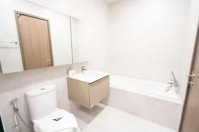 a bathroom with a toilet and a sink and a tub at Canvas 11112 Cozy 2BR Residence in Phuket Town