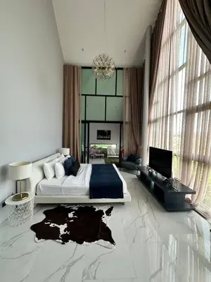 a bedroom with a large bed and a large window at Bangtao Family Villa with Pool in Ban Pak Lak