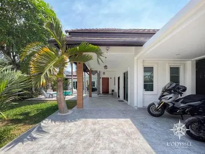 a motorcycle parked in front of a house at V292 Central Rawai Private Pool Villa with Amenities in Rawai Beach