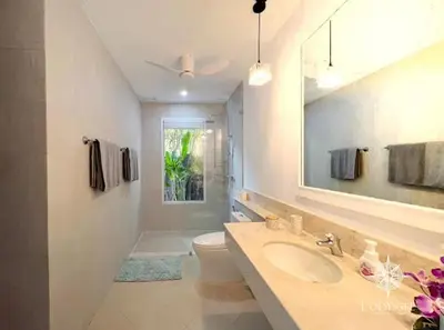 a bathroom with a sink and a toilet and a mirror at V292 Central Rawai Private Pool Villa with Amenities in Rawai Beach