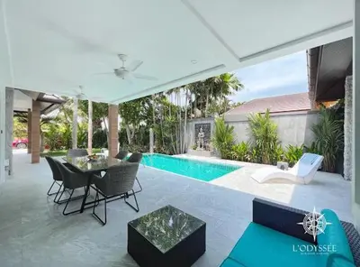 a patio with a table and chairs and a pool at V292 Central Rawai Private Pool Villa with Amenities in Rawai Beach