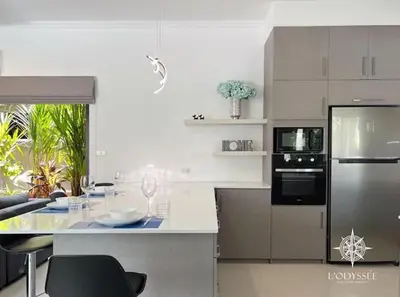 a kitchen with a counter top with a stove top oven at V292 Central Rawai Private Pool Villa with Amenities in Rawai Beach