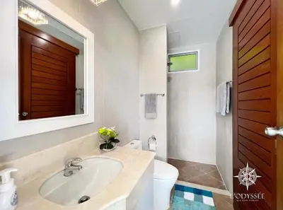 a bathroom with a sink and a toilet and a mirror at V292 Central Rawai Private Pool Villa with Amenities in Rawai Beach