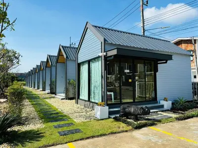 a row of houses lined up on a street at Tavana Residence in Ban Na Bon