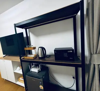 a room with a desk with a computer on it at Phuket gateway inn in Kathu