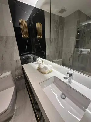 a white bathroom with a sink and a toilet at Stylish Apartments in a New Boutique Complex in the Laguna in Laguna Phuket