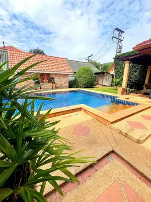 a swimming pool in the backyard of a house at Luxury 3-bedroom villa with pool in Rawai in Rawai Beach