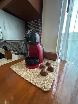 a red mixer sitting on top of a table at Villa Bang Tao Ananda Lake View in Ban Pak Lak