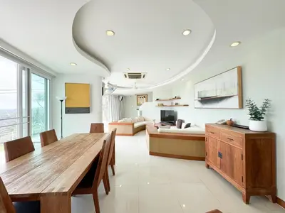 a living room with a table and a couch at Villa Neptune Phuket - Luxury 6BR with Private Pool, Chalong in Ban Klang