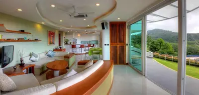 a living room with a couch and a table at Villa Neptune Phuket - Luxury 6BR with Private Pool, Chalong in Ban Klang