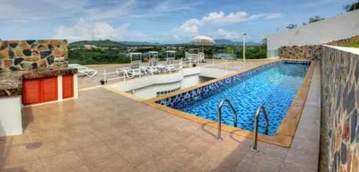 a swimming pool on top of a building at Villa Neptune Phuket - Luxury 6BR with Private Pool, Chalong in Ban Klang