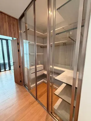 a glass cabinet with shelves in a room at New 3 Bed Villa Mono Oxygen Bangtao in Ban Thalat Choeng Thale