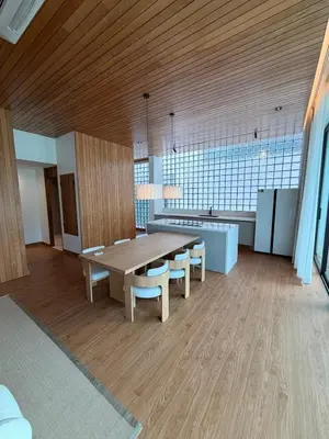a large room with a wooden table and chairs at New 3 Bed Villa Mono Oxygen Bangtao in Ban Thalat Choeng Thale