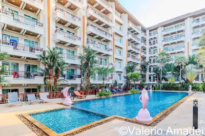 an apartment complex with a swimming pool in a resort at Patong Center - Pool Gym Near Bangla Rd in Patong Beach