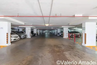 an empty parking garage with cars parked in it at Patong Center - Pool Gym Near Bangla Rd in Patong Beach