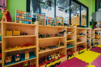 a toy store with shelves full of toys at Love Rawai Hotel in Rawai Beach