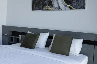 a bedroom with a bed with white sheets and pillows at Villa Wallaya with pool in Bang Tao in Ban Pak Lak