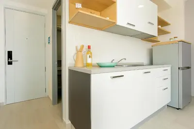 a kitchen with a sink and a counter top at Woodbridge Property at Tower Chalong in Ban Klang