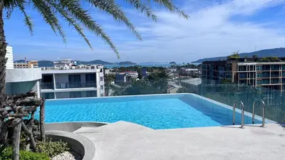 a large swimming pool on top of a building at Woodbridge Property at Tower Chalong in Ban Klang