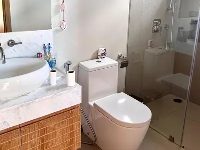 a bathroom with a toilet and a sink and a shower at Top Pick Brand New Modern Resort Pool Villa in Laguna Phuket