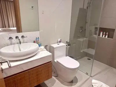 a bathroom with a sink and a toilet and a shower at Top Pick Brand New Modern Resort Pool Villa in Laguna Phuket