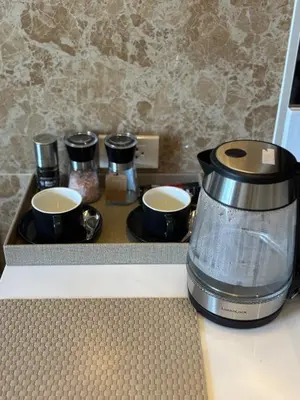 a coffee maker and two cups on a counter at Bellevue Lagoon Boutique - Bang Tao, Phuket Laguna in Laguna Phuket