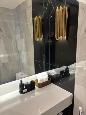 a bathroom with a white sink and a mirror at Bellevue Lagoon Boutique - Bang Tao, Phuket Laguna in Laguna Phuket