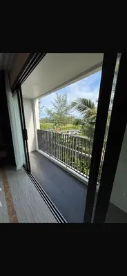 a room with a view of a balcony at Bellevue Lagoon Boutique - Bang Tao, Phuket Laguna in Laguna Phuket