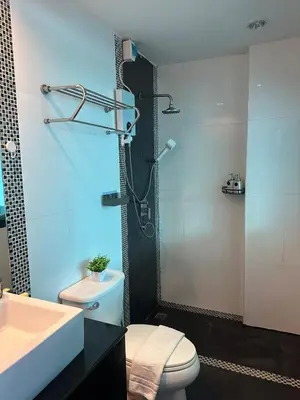 a bathroom with a toilet and a sink and a shower at Grand Patong Apartment 6FL in Patong Beach