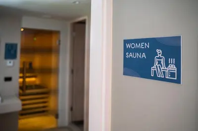 a sign on a wall that reads women sauna at Comfortable 2Bdr Bangtao Space Condo in Ban Thalat Choeng Thale