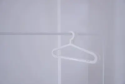 a white towel rack hanging on a wall at BAO Phuket Patong- ไสน้ำเย็น ซอย 1 in Patong Beach