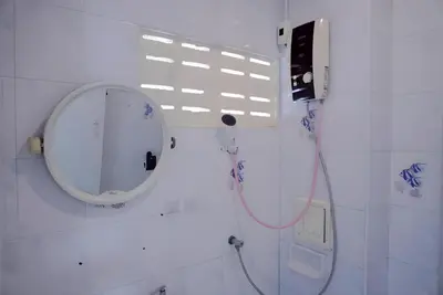 a bathroom with a mirror and a shower at BAO Phuket Patong- ไสน้ำเย็น ซอย 1 in Patong Beach