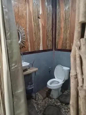 a bathroom with a toilet and a sink at Kohyaonoi Lastfisherman in Ko Yao Noi