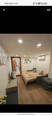 a bedroom with a large bed in a room at BaanNiraบ้านนิรา in Ban Sam Kong