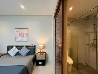 a bedroom with a king sized bed and a shower at Pool Villa in Phuket 3rooms for family in Kamala Beach