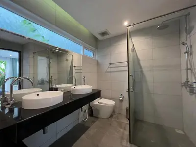 a bathroom with two sinks and a toilet and a shower at Pool Villa in Phuket 3rooms for family in Kamala Beach