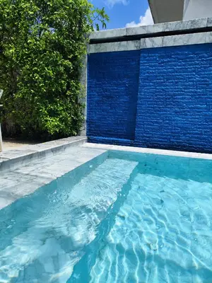 a swimming pool with a blue tile wall at Pool Villa in Phuket 3rooms for family in Kamala Beach